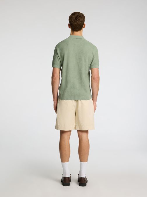 KÖTÖTT CIPZÁRAS GALLÉROS PÓLÓ